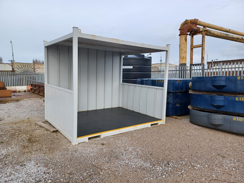 Steel smoking shelter in workshop yard